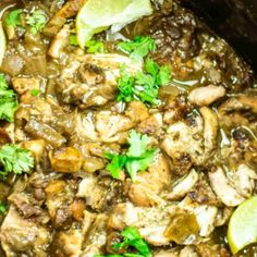 chicken and mushroom stew with cilantro in a slow cooker, garnished with parsley