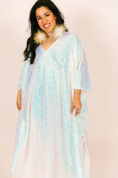 Be the life of the party in this long sequin caftan! This show-stopping caftan is adorned with shimmering sequins that will catch the light and turn heads. With a flowy, relaxed fit, it combines style and comfort. The long length ensures you'll bring the fashion drama, while the sequins add a touch of glamour to your look. These comfortable sequins on mesh are ulined for maximum breeze. Sequin Caftan, Iridescent Sequin, Life Of The Party, Long Length, Head Wraps, The Fashion, Sequin, Drama, Relaxed Fit