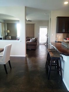 the kitchen and living room are clean and ready for us to use in their new home