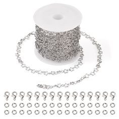 a spool of silver colored chain with hooks and chains attached to the spool