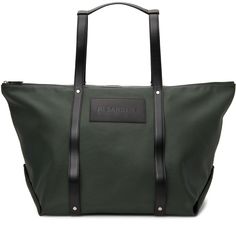 Coated cotton and nylon canvas tote bag in green. Buffed calfskin trim throughout. Twin carry handles at top. Embossed calfskin logo patch in black at face. Integrated shoulder straps at back face. Zip closure at main compartment. Zippered pocket at interior. Cotton canvas and buffed calfskin lining. Silver-tone hardware. Approx. 25 length x 14 height x 10 width. Supplier color: Medium green Jil Sander, Canvas Tote Bag, Sanders, Luxury Streetwear, Canvas Tote, Patch Logo, Shoulder Straps, Zipper Pocket, Calf Skin