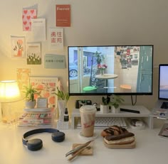 a desk with two computer monitors on it