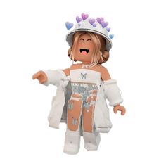 a small doll wearing a white outfit with hearts on it's head and arms