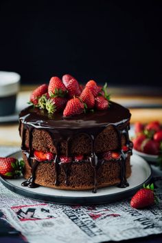 a chocolate cake with strawberries on top