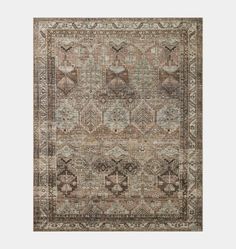 an area rug with various colors and patterns on it, including beiges, browns,