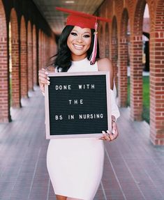 a woman wearing a graduation cap and gown holding a sign that says, don't with the bsn nursing