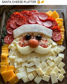 a santa cheese platter with pepperoni, sausage and cheese on it's face