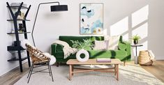 a living room with green couches and wooden tables in front of a white wall