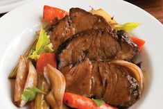 beef and veggie pot roast on a white plate