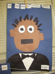 a paper cut out of a man in a tuxedo with hair and mustaches