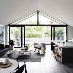 an instagramted photo of a living room and kitchen