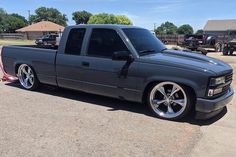 a black truck parked in a parking lot