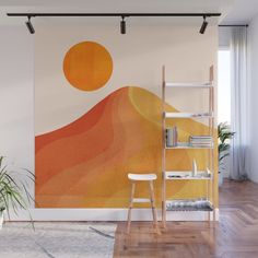 an orange and yellow wall mural in a living room