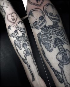 two skeleton tattoos on both arms, one with a heart and the other with a skull