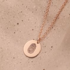 The Chiara necklace is a light gold round disc necklace that you just NEED. Whether you wear it alone or stacked, with your another necklace or bare alone- it's perfect. Add a personal touch to your Chiara necklace with an engraved fingerprint of a loved one. If you can dream it- we can make it happen. Chain Length: Length: 42cm/16" (extension: 3cm/1.8") Total 45cm/18" Element: Size: 10mm All features can be customized! Talk to us, we love making custom designs. Our jewelry is carefully handmade in our atelier Hand Stamped Minimalist Pendant Necklace, Minimalist Hand Stamped Pendant Necklace, Minimalist Engraved Circular Jewelry, Minimalist Engraved Circle Jewelry, Minimalist Circular Engraved Jewelry, Hand Stamped Sterling Silver Necklaces In Yellow Gold, Engraved Yellow Gold Medallion Necklace In Round Disc Shape, Engraved Yellow Gold Round Disc Medallion Necklace, Engraved Yellow Gold Medallion Necklace