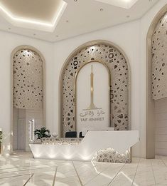 the interior of a building with white and gold decor