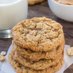 a stack of cookies sitting next to a glass of milk