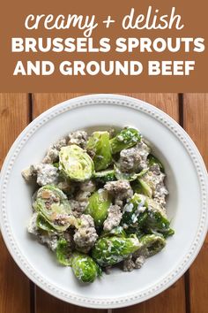 a white plate topped with brussel sprouts and ground beef