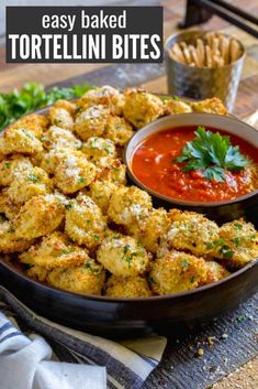 tortellini bites in a pan with dipping sauce and parsley on the side