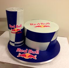 a red bull cake and cup on a table