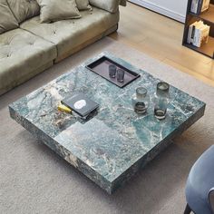 a marble coffee table in the middle of a living room