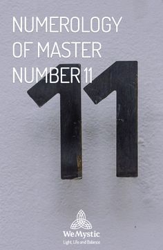 the numerology of master number 11 is written in black on a white wall