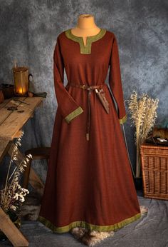 The dress has simple medieval cut with long sleeves, loose and comfortable. The historical pattern - an important element when playing historical realities, especially Vikings or Slavs. Put on your cloak and travel back to the Middle Ages. Hunting, ancient legends, the warmth of the hearth and our dress will give you an unforgettable experience. The simple cut of the dress allows you to move freely, as well as boldly add accessories to the dress. The dress will perfectly fit into the basic wardr Long Sleeve Medieval Dress With Historical Design For Fall, Medieval Long Sleeve Dresses For Fall, Fall Medieval Dress With Historical Design, Fall Medieval Dress With Long Sleeves, Vintage Long Sleeve Medieval Dress For Larp, Viking Style Medieval Dress For Winter, Viking Style Medieval Dress Costume For Winter, Winter Medieval Dress With Historical Design, Fall Medieval Dress Costume With Historical Design