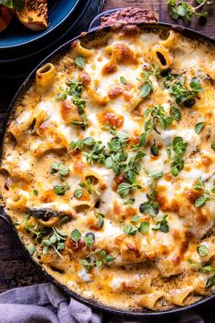 a casserole dish with cheese and vegetables