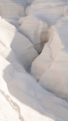 a man riding skis down a snow covered slope