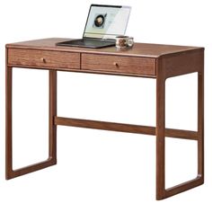 a wooden desk with a laptop on it