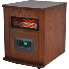 an electric heater sitting on top of a wooden table