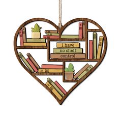 a wooden heart shaped ornament with bookshelves in the shape of a heart