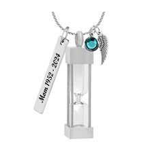 "● Hourglass Necklace Ash Urn - Love Charms™ Option is made of stainless steel and glass, so perfect and beautiful, a beautiful way to remember a special loved one.    ● FREE Birthstone ● FREE 18\" Stainless Chain ● FREE Gift Box  ● FREE Fill Kit ● FREE Shipping on second or more items ● Your order will include a free 18 Stainless Steel Chain and Birthstone. ● Your pendant arrives in a Gift Box of black & mint, imprinted \"In Loving Memory\" gift box.  ● Your fill kit includes a funnel, tube of adhesive, tooth pick and instructions. ● We can engrave the Stainless Tag with up to 17 characters for 16.00.  This cost, includes the Mini Angel Wing. EXAMPLE: In Loving Memory ● Excellent quality, the ash urn measures 1\" tall with a threaded top closure. ● Stainless Steel is similar to everyday f Silver Glass Necklace Keepsake, Silver Glass Necklace For Keepsake, Silver Glass Jewelry For Keepsake, Hourglass Necklace, In Loving Memory Gifts, Everyday Flats, Keepsake Urns, Loving Memory, Love Charms