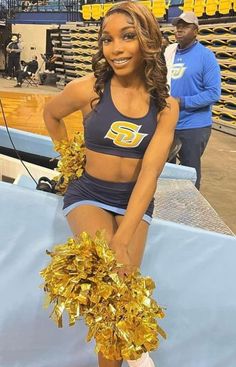 a cheerleader is posing for the camera