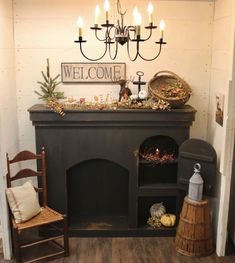 a fireplace with a welcome sign above it