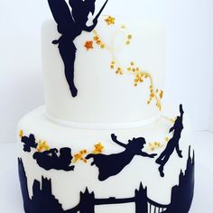 a white and blue wedding cake with tinker stars on the top is featured in an instagram