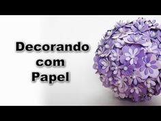 a paper ball with flowers on it and the words decorando com papel