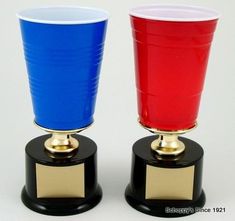 two red and blue cups sitting on top of each other in front of a white background