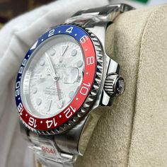 This exceptional timepiece is a Rolex GMT-Master II "Pepsi," instantly recognizable by its iconic red and blue Cerachrom ceramic bezel. What sets this watch apart is its mesmerizing meteorite dial, showcasing a unique pattern formed over billions of years in the cosmos. Crafted from 18ct white gold, the case and Oyster bracelet exude luxury and durability. The watch is powered by the Rolex Caliber 3285, a Superlative Chronometer certified movement known for its precision and 70-hour power reserv Buy Rolex, Rolex Gmt Master Ii, Oyster Bracelet, Time Zones, Loafer Sneakers, Bottega Veneta Shoulder Bag, Rolex Gmt, Iconic Design, The Cosmos