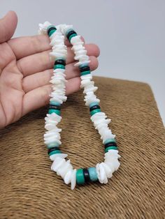 "White & Turquoise Puka shell Necklace. Handmade with white seashell and Turquoise color wooden beads and black wooden beads 18\" Inches Around the neck Handmade Design. Necklace is Unisex Fits Most Sizes FAST SHIPPING! *First Class Mail* Visit my Etsy Shop to see more Designs! Handmade Earrings, Puka Shell Bracelets and Puka Shell Necklaces. Click here to see more designs: https://www.etsy.com/shop/FreedomLifeStyle" White Bohemian Turquoise Necklace As Gift, Bohemian White Turquoise Necklace As Gift, Handmade Adjustable White Turquoise Necklace, Adjustable White Turquoise Necklace With Natural Stones, Bohemian Style Turquoise Gemstone Beads Necklace, Bohemian White Turquoise Gemstone Beads Necklace, Bohemian White Turquoise Necklace With Natural Stones, White Turquoise Necklace With Natural Stones, Adjustable, Turquoise Round Beads Shell Necklace For Vacation