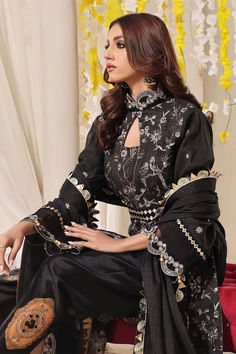 SHIRT STYLE: Mock neck long front open Shirt FABRIC: Gold Zari Front fully embroidered, Embellished neckline of shirt with embroidered sleeves and back. Color: Black TROUSER Embellished Silk Grip Trouser Color: Black DUPATTA Embellished Organza Dupatta Luxury Suit, Black Dupatta, Chiffon Suit, Open Shirt, Embellished Neckline, Printed Dupatta, Embroidered Sleeves, Embroidered Chiffon