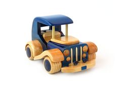 a wooden toy truck on a white background