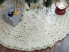 a christmas tree skirt with presents under it