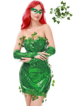 a woman dressed in green is standing with her arms crossed and wearing a costume that has ivy leaves on it