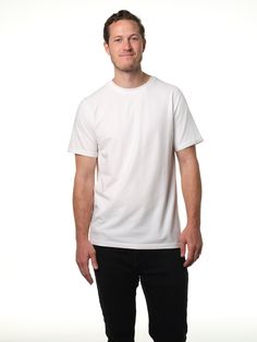 Male model grinning wearing our white t-shirt Simple Organic Cotton Short Sleeve T-shirt, Minimalist Relaxed Fit T-shirt, Basic Everyday Pre-shrunk Shirt, Basic White T-shirt For Everyday, Simple Relaxed Fit T-shirt For Everyday, Basic Everyday T-shirt, Simple Everyday Crew Neck T-shirt, Minimalist Basic Style Relaxed Fit T-shirt, Minimalist Basic T-shirt With Relaxed Fit