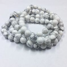 High Quality Natural Howlite Gemstone Beads. Quantity:  One 15"  strand - approx. 48 beadsShape:   RoundSize:   8mmFinish: Smooth ShinyFind more gemstone strands here: https://www.etsy.com/shop/thebeadgalleryA2?section_id=24259658Processing time:1-3 daysShipping:2-5 days standard USPS shipping methods. Carnelian Beads, White Howlite, Coral Beads, Metal Beads, Round Beads, Gemstone Beads, Beaded Bracelets, Gems, Beads