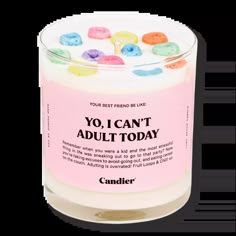 a candle that is filled with candy and the words yo i can't adult today