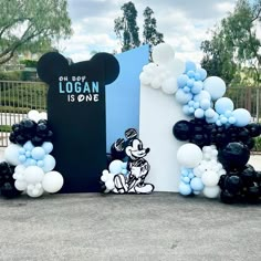 mickey mouse balloon arch with blue and white balloons