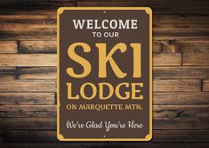 a sign that says ski lodge on marquette mtn we're glad you're here