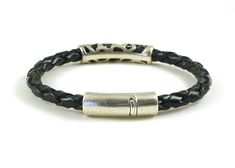 "Unique mens jewelry boho chic braided bracelet in black genuine leather. Features a beautiful tribal antiqued silver tube bead, and a secure tube shaped magnetic silver clasp. Made from 5 mm round braided leather and Sterling silver Zamak hardware, that's hypoallergenic, certified lead and nickel free. A stylish silver and leather bracelet for him (or for her) that's made to fit in the size you select from the drop down menu. **EASY SIZING: Wrist size (measured without slack) + wiggle room (1/4 Black Engraved Leather Bracelet For Everyday, Everyday Black Leather Bracelet Engraved, Everyday Black Engraved Leather Bracelet, Everyday Black Braided Leather Bracelet, Adjustable Black Leather Bracelet With Lobster Clasp, Everyday Adjustable Braided Bracelet With Lobster Clasp, Casual Silver Jewelry With Black Band, Handmade Black Leather Braided Bracelet, Black Handmade Braided Bracelets For Everyday